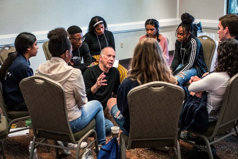 Jim training peer counselors in a seated circle in Broward County, Florida after the Parkland shooting.